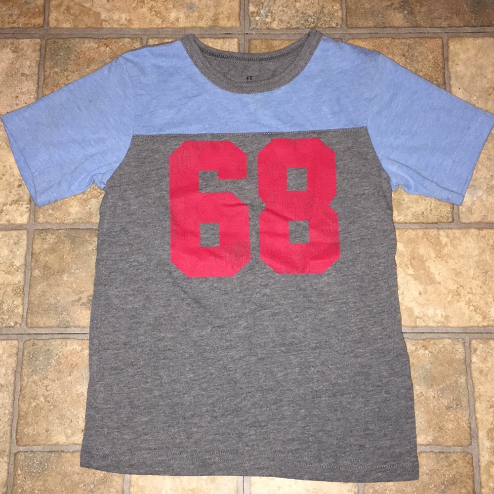 Children place football shirt